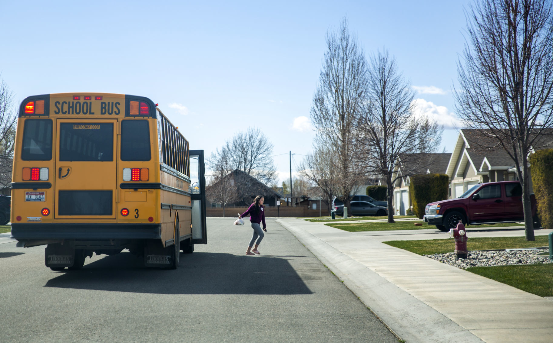 Bus drivers deliver food to students